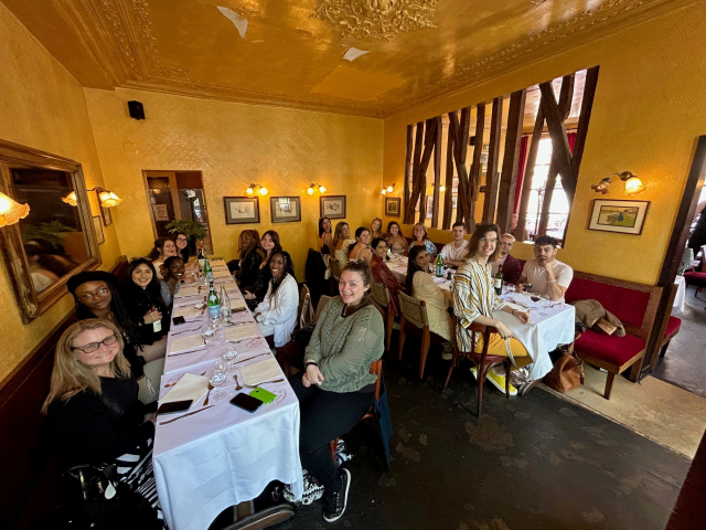 Students in France in a fancy but homey french restraunt