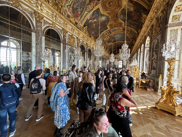 Students in France group shot and exploring a mansion